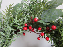 Christmas wreath with foliage/red berries