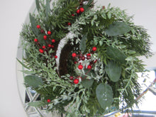 Christmas wreath with foliage/red berries